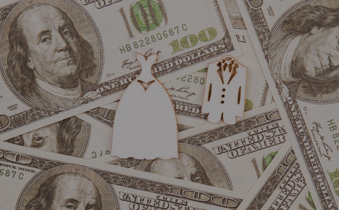 Wedding costumes on the heap of dollars.